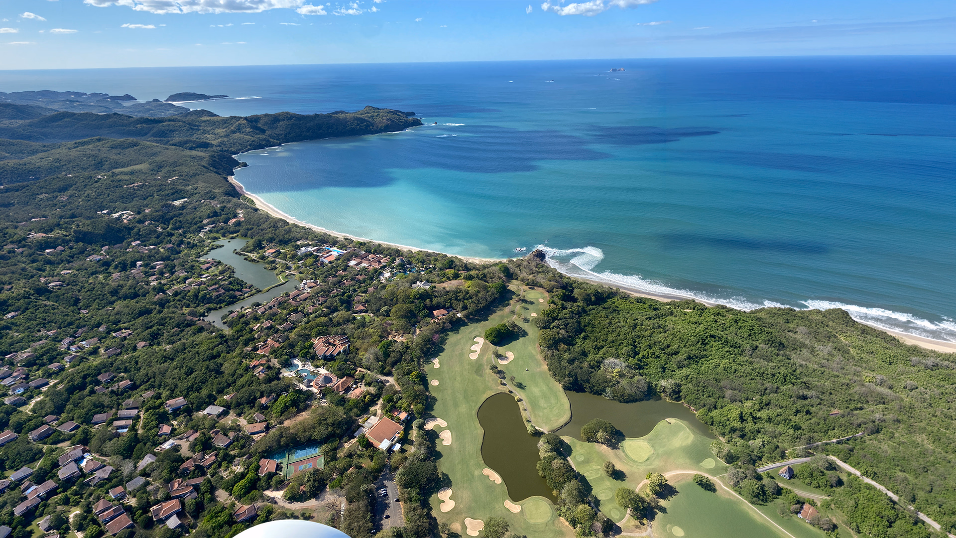 Aerial view of the Tamarindo coastline from a gyrocopter